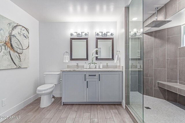13012 N 36th Dr, Phoenix, AZ 85029 - full bathroom featuring double vanity, tiled shower, and wood finished floors