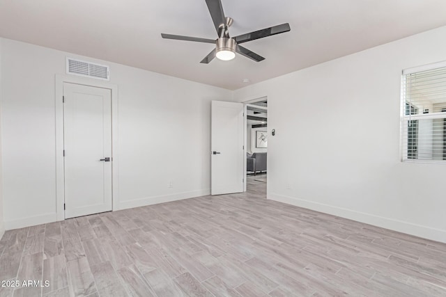 13012 N 36th Dr, Phoenix, AZ 85029 - spare room featuring light wood-style floors and ceiling fan