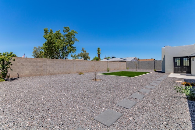 13012 N 36th Dr, Phoenix, AZ 85029 - fenced backyard featuring french doors and a patio