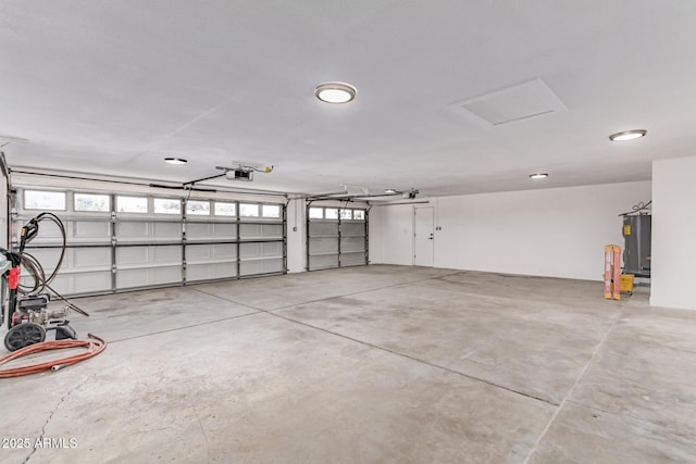 13012 N 36th Dr, Phoenix, AZ 85029 - garage featuring a garage door opener and water heater