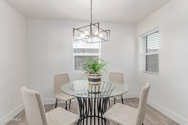 13012 N 36th Dr, Phoenix, AZ 85029 - dining room featuring a chandelier and light wood-style flooring