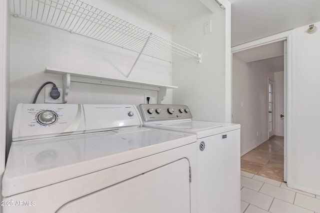 laundry room featuring washer and dryer and laundry area