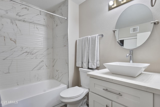 full bathroom featuring toilet, visible vents, shower / bathing tub combination, and vanity