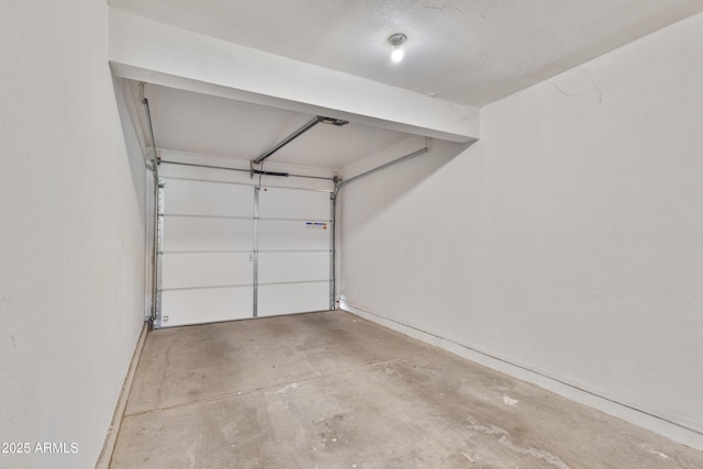 garage featuring baseboards