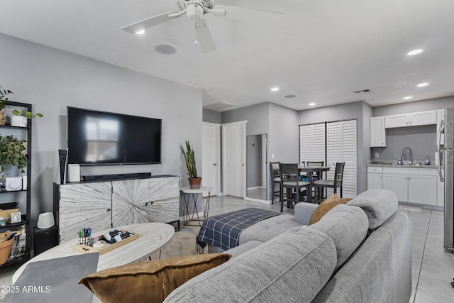 4410 S 12th Dr Unit 1-2, Phoenix, AZ 85041 - living area featuring light tile patterned floors, ceiling fan, recessed lighting, and baseboards