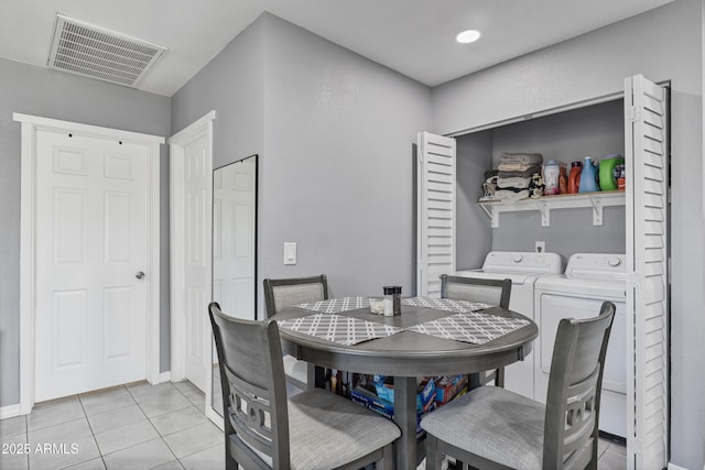 4410 S 12th Dr Unit 1-2, Phoenix, AZ 85041 - dining space with separate washer and dryer, light tile patterned flooring, and baseboards