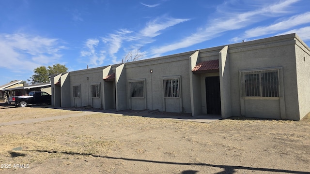 view of property featuring an attached carport