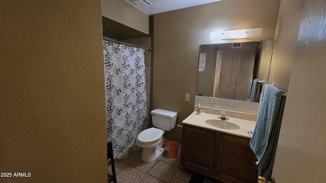 bathroom featuring vanity, tile patterned flooring, a shower with curtain, and toilet