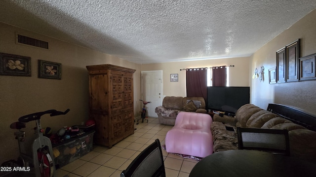 tiled living room with a textured ceiling