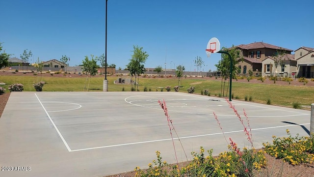 view of basketball court featuring a lawn