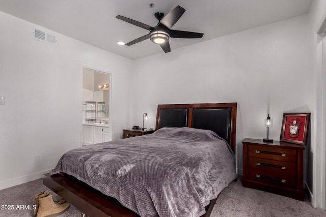 10101 N Arabian Trl Unit 2018, Scottsdale, AZ 85258 - bedroom with carpet floors, connected bathroom, baseboards, and a ceiling fan