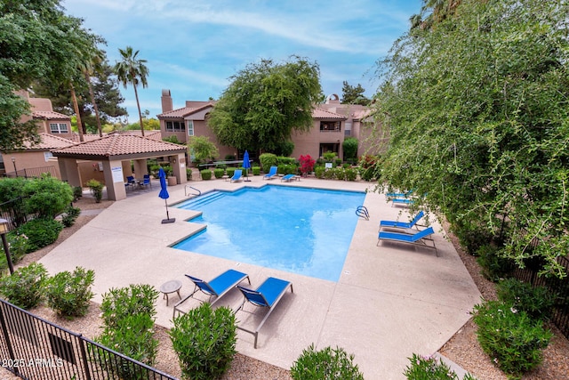 10101 N Arabian Trl Unit 2018, Scottsdale, AZ 85258 - community pool featuring a patio, fence, and a residential view