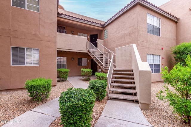10101 N Arabian Trl Unit 2018, Scottsdale, AZ 85258 - property entrance featuring stucco siding and a tile roof
