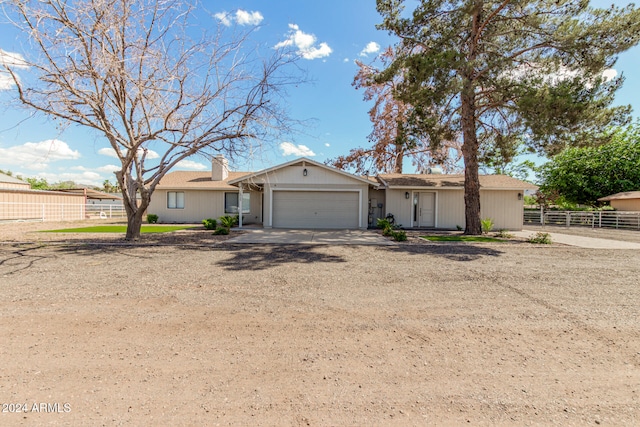 single story home featuring a garage