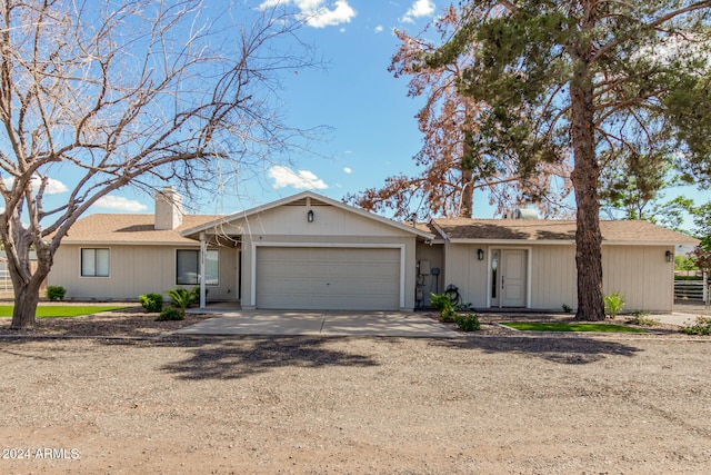 ranch-style house featuring a garage