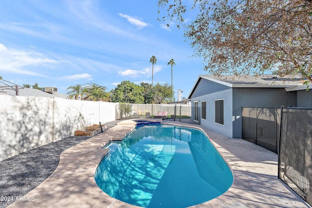 view of swimming pool with a patio area