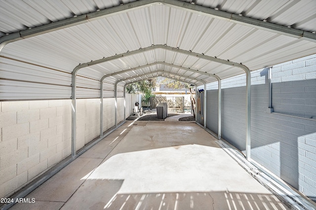 view of vehicle parking with a carport