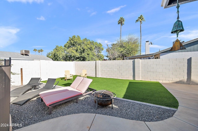 view of patio with an outdoor fire pit