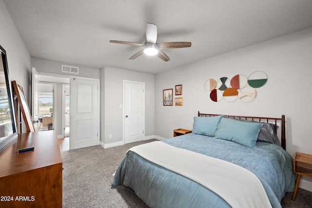 carpeted bedroom with ceiling fan