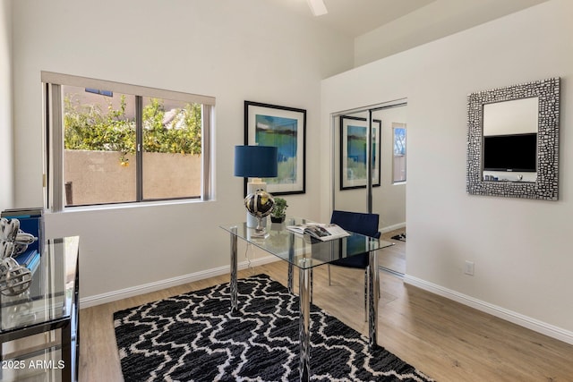 office space with wood finished floors and baseboards