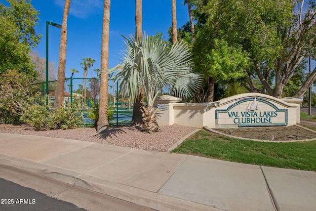 community sign with fence