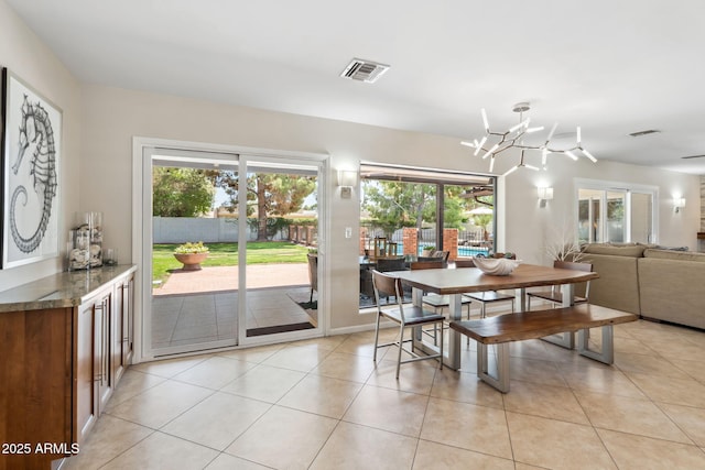 401 E Braeburn Dr, Phoenix, AZ 85022 - dining space with plenty of natural light and light tile patterned floors