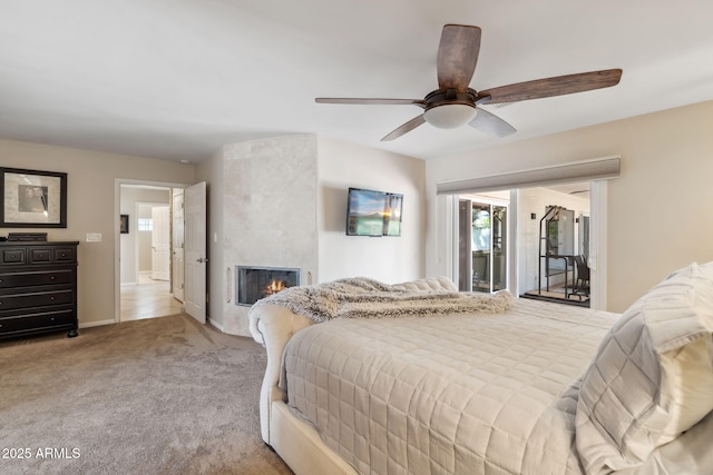 401 E Braeburn Dr, Phoenix, AZ 85022 - bedroom with access to exterior, carpet flooring, a fireplace, ceiling fan, and baseboards