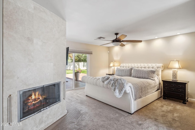 401 E Braeburn Dr, Phoenix, AZ 85022 - bedroom with access to exterior, carpet flooring, a tile fireplace, a ceiling fan, and recessed lighting