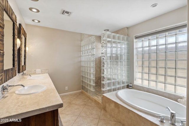 401 E Braeburn Dr, Phoenix, AZ 85022 - bathroom with a garden tub, double vanity, tile patterned flooring, and walk in shower