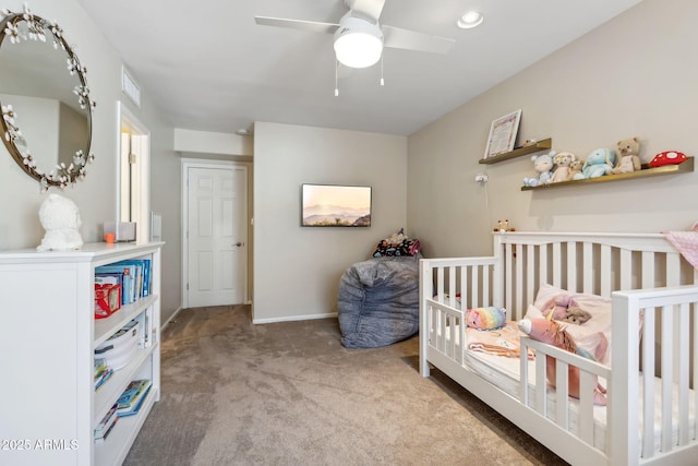 401 E Braeburn Dr, Phoenix, AZ 85022 - bedroom with carpet, baseboards, a crib, and a ceiling fan