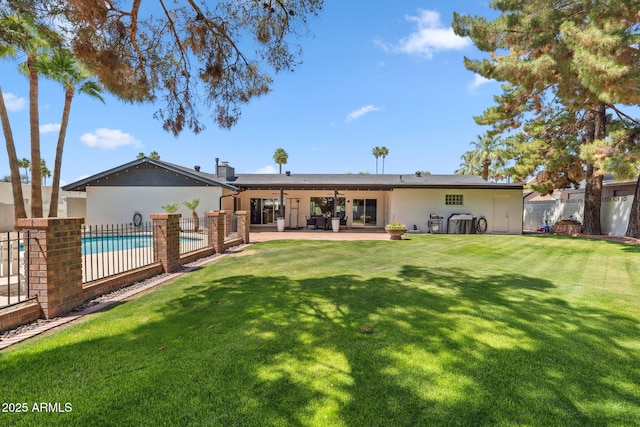 401 E Braeburn Dr, Phoenix, AZ 85022 - back of house featuring a patio area and a chimney