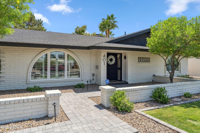 401 E Braeburn Dr, Phoenix, AZ 85022 - view of front facade with brick siding and a shingled roof