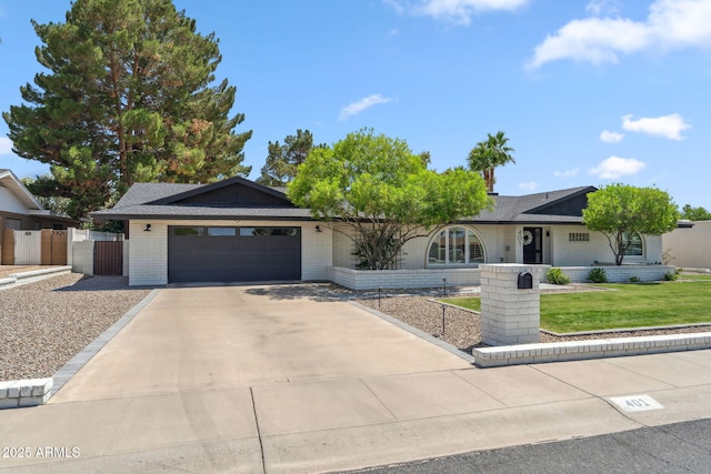 401 E Braeburn Dr, Phoenix, AZ 85022 - single story home featuring a garage, driveway, and brick siding