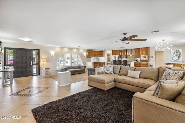 401 E Braeburn Dr, Phoenix, AZ 85022 - living room with light tile patterned floors, a ceiling fan, recessed lighting, and a chandelier