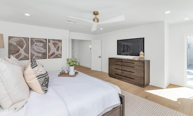 bedroom with baseboards, light wood-style flooring, and recessed lighting