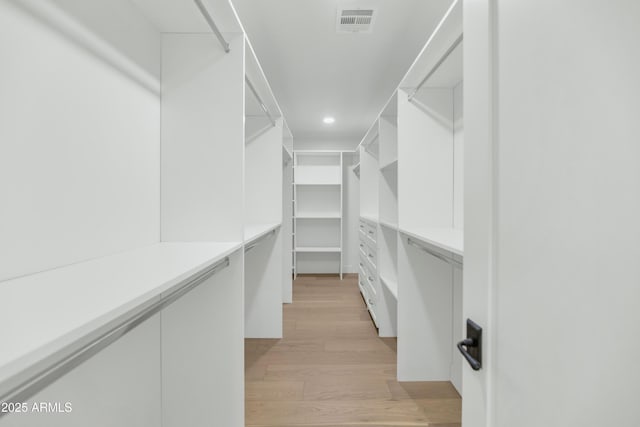 walk in closet with visible vents and light wood-style floors