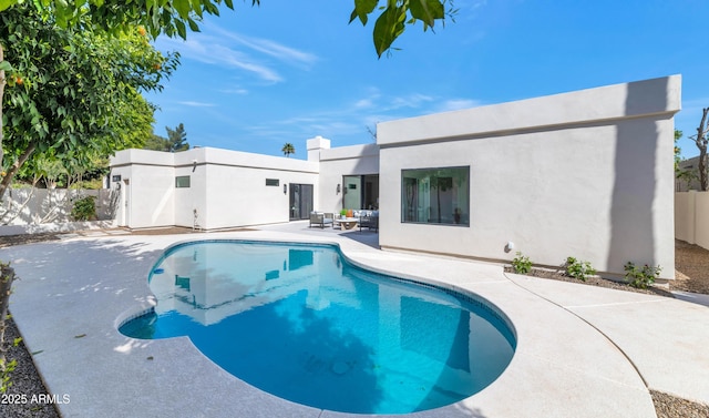 view of pool featuring a patio, fence, and a fenced in pool