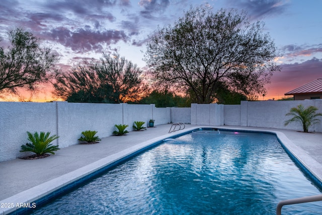 view of swimming pool featuring a fenced in pool, a patio area, and a fenced backyard