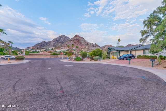 view of road featuring a residential view and a mountain view