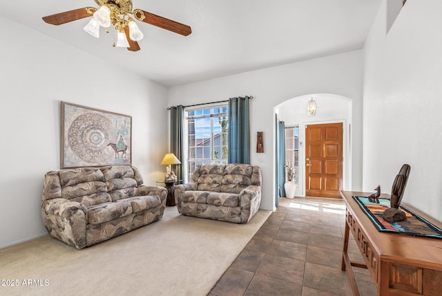 living room with carpet floors and ceiling fan