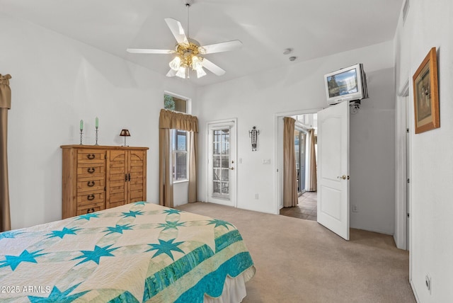 carpeted bedroom with access to exterior and ceiling fan