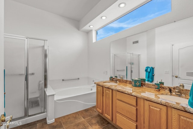 bathroom featuring shower with separate bathtub and vanity