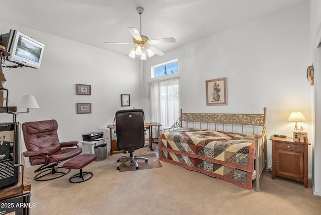 bedroom featuring a high ceiling, carpet, and ceiling fan