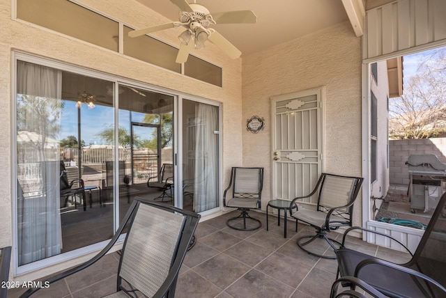 view of patio featuring ceiling fan