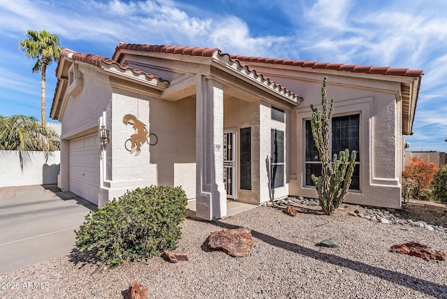 view of front of property with a garage