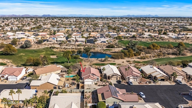 drone / aerial view featuring a water and mountain view