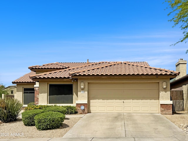4208 E Hamblin Dr, Phoenix, AZ 85050 - view of front of property featuring driveway, stucco siding, and an attached garage