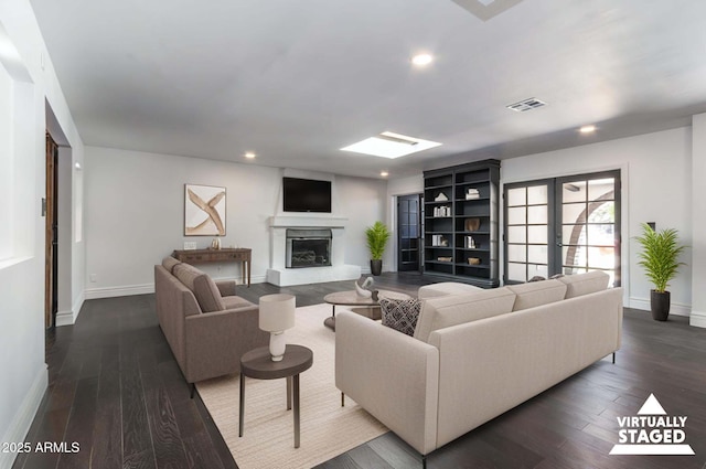 3646 W Brown St, Phoenix, AZ 85051 - living room featuring baseboards, dark wood-type flooring, recessed lighting, and a glass covered fireplace