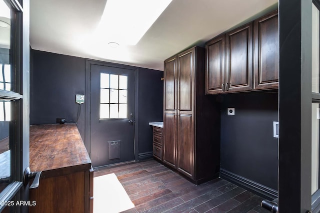 3646 W Brown St, Phoenix, AZ 85051 - washroom with cabinet space, electric dryer hookup, dark wood-type flooring, and baseboards