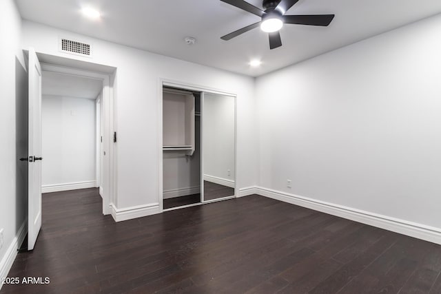 3646 W Brown St, Phoenix, AZ 85051 - unfurnished bedroom with dark wood-style flooring, baseboards, a closet, and a ceiling fan